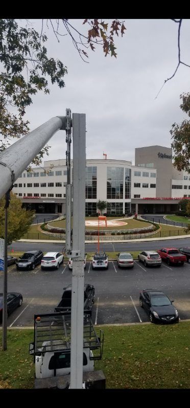 A large building with a lot of cars parked in front of it