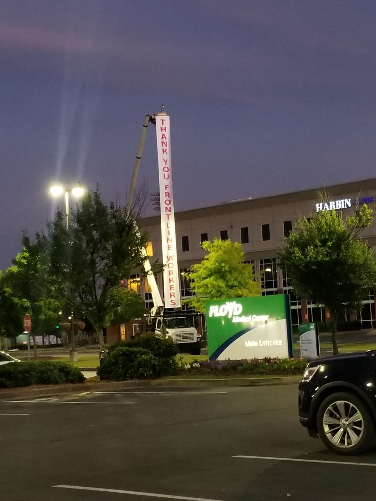 A car is parked in front of a building with a sign that says emergency room