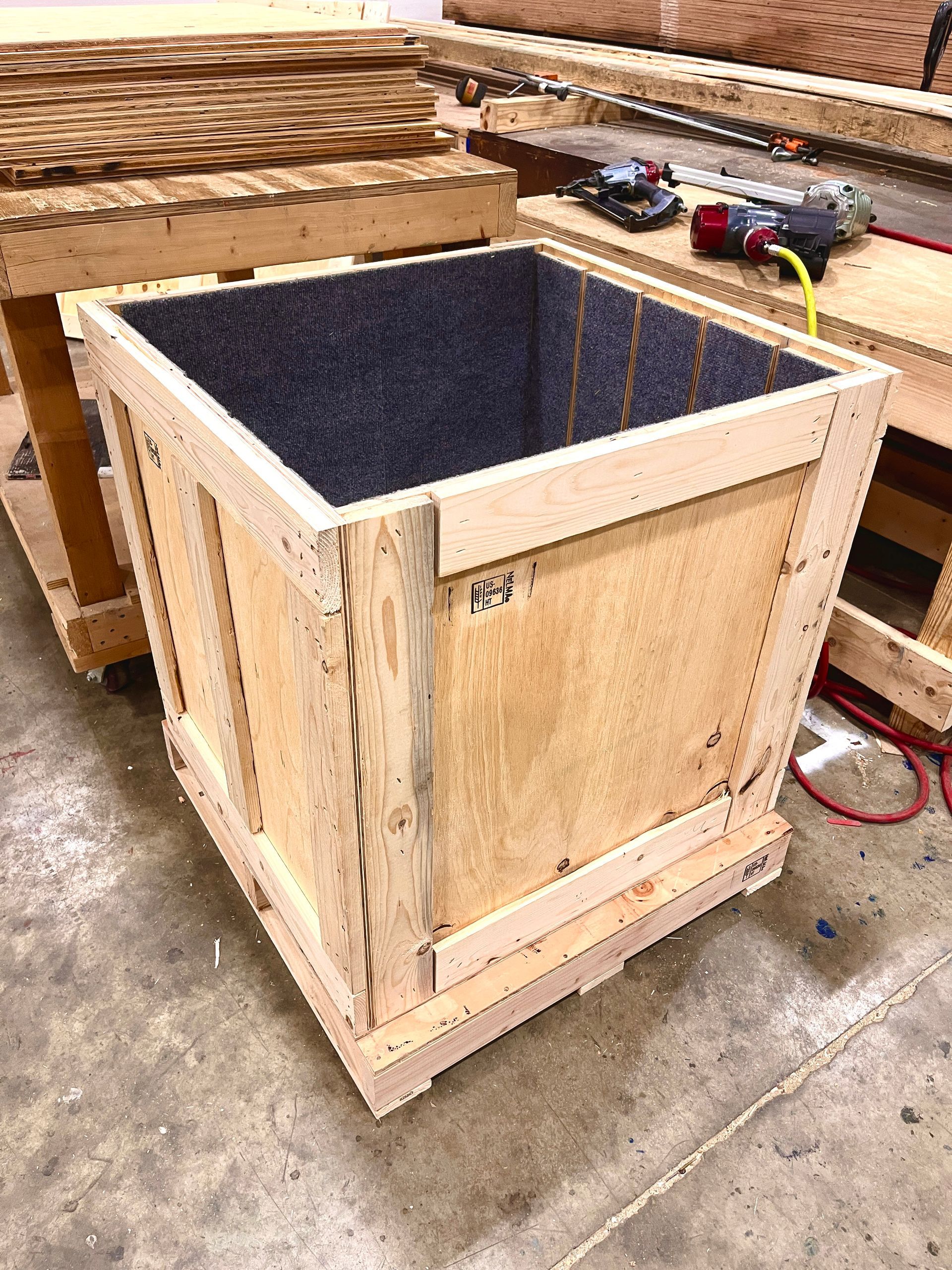 A view of a crate meant to hold 4 felt-lined partitions with the partitions removed