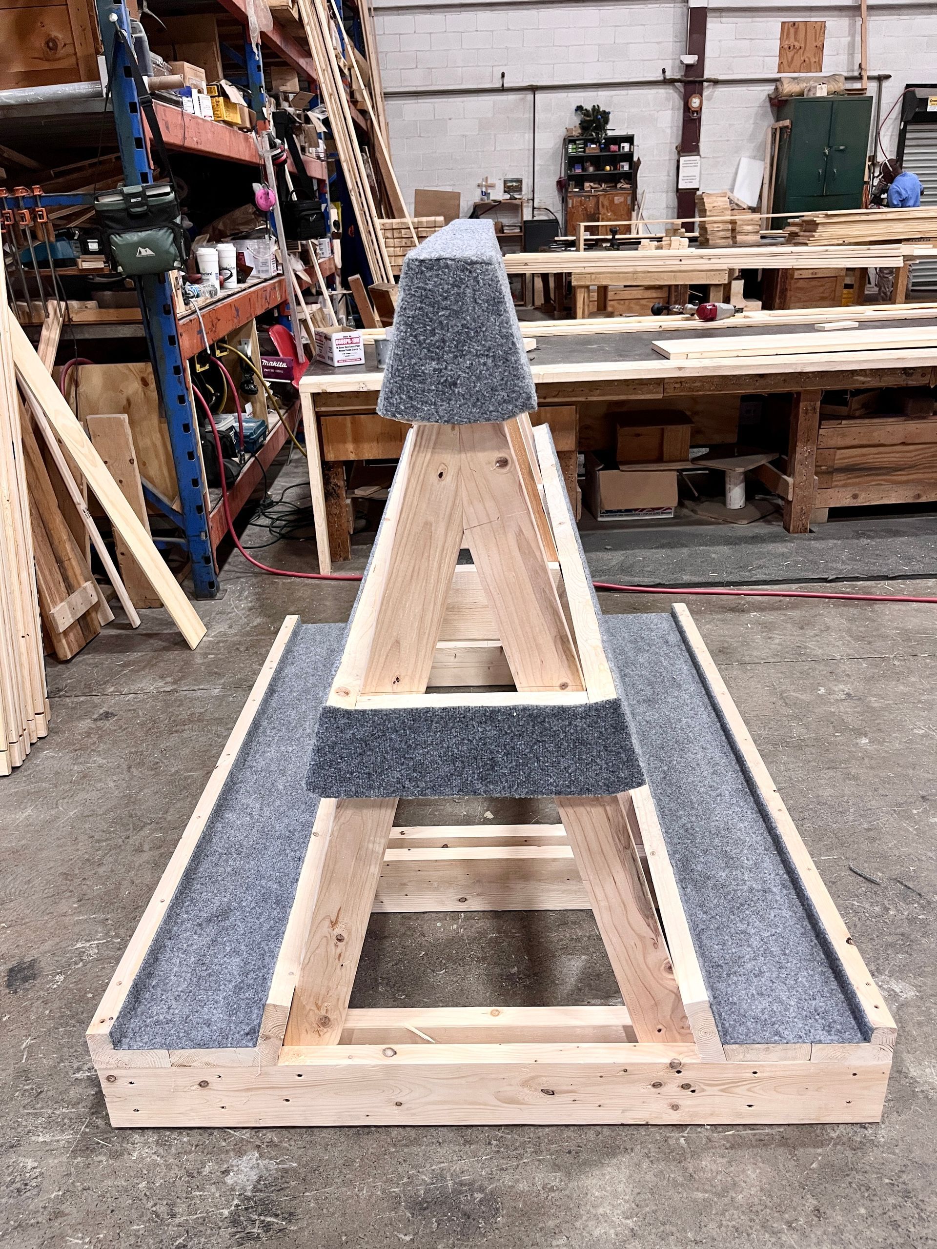 The completed A-frame glass storage rack constructed by Commerce Packaging Corporation, viewed from the side, now with felt attached.