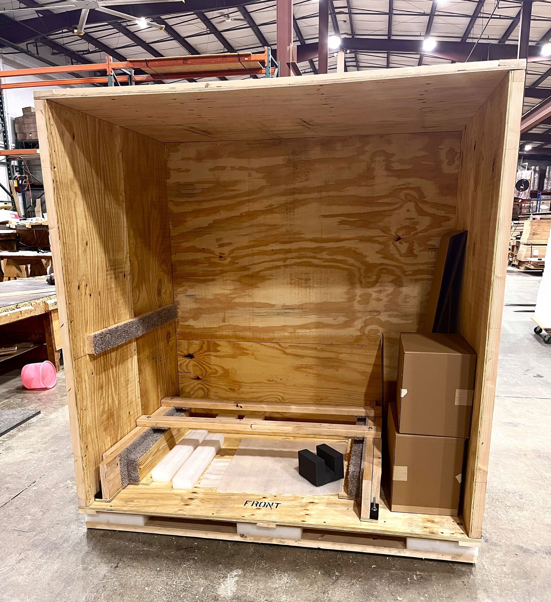 The crate we created to protect an SMT, with the front open to show off the interior.