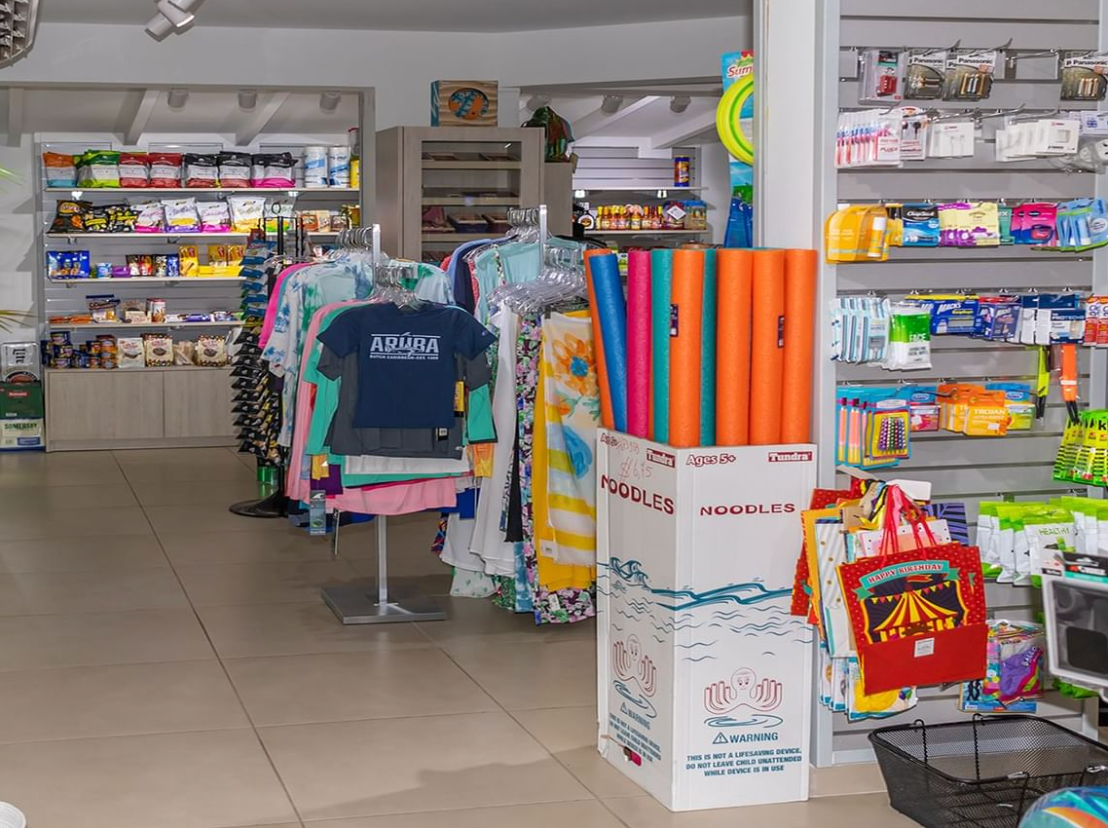 A store filled with lots of clothes and water toys.