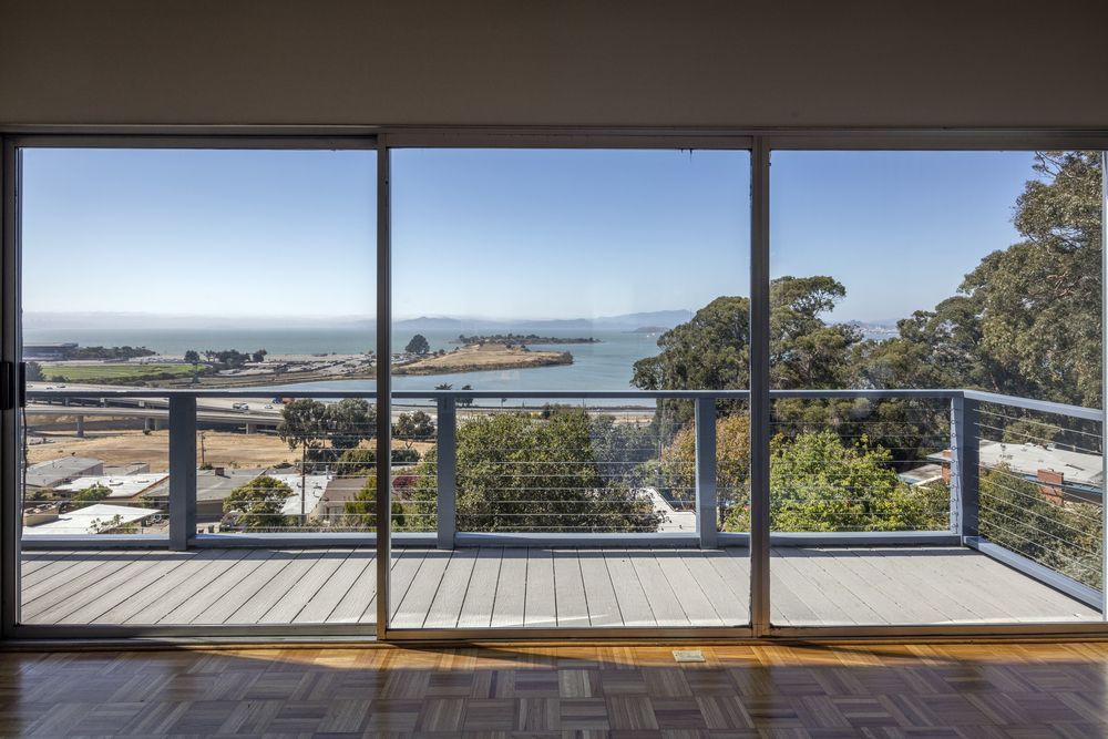 Large Clean Glass Sliding Doors With Bay View — Window Repairs in Launceston. TAS
