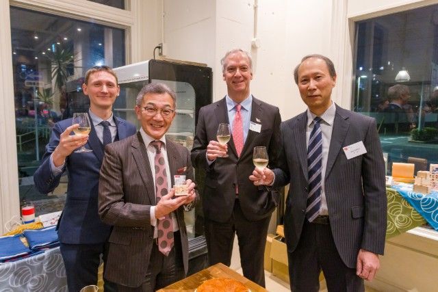Representatives of international organizations raise a toast during the reception