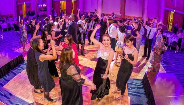 People dancing at a gala event at Hilton Nagoya