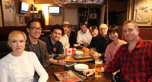 a group of TJCS members at a monthly TGIF event