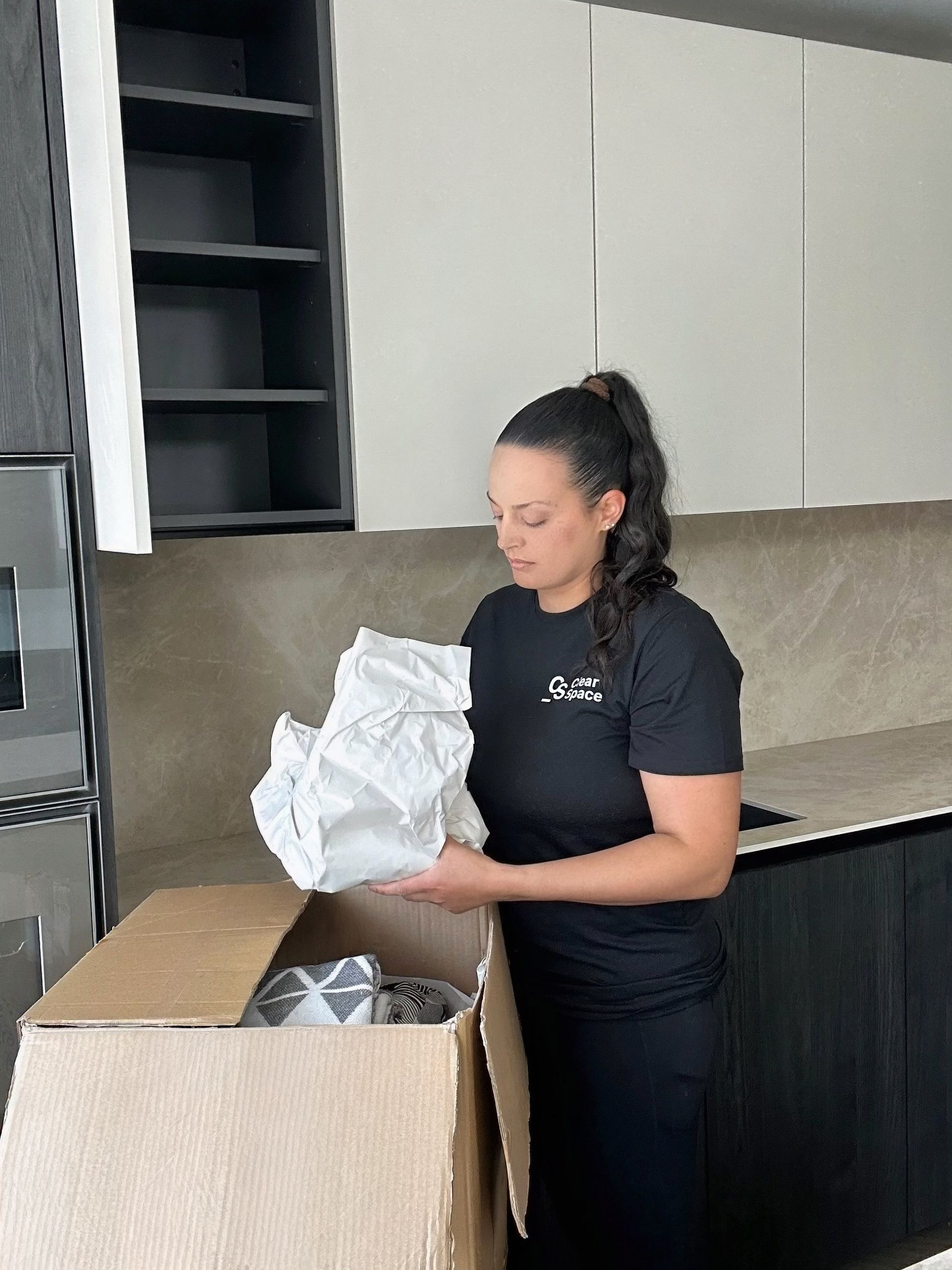 Organising kitchen cupboards in Hertfordshire home