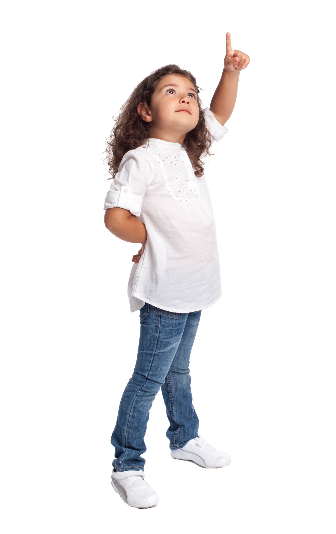 Girl points upward, wearing a white shirt and jeans, looking curious.