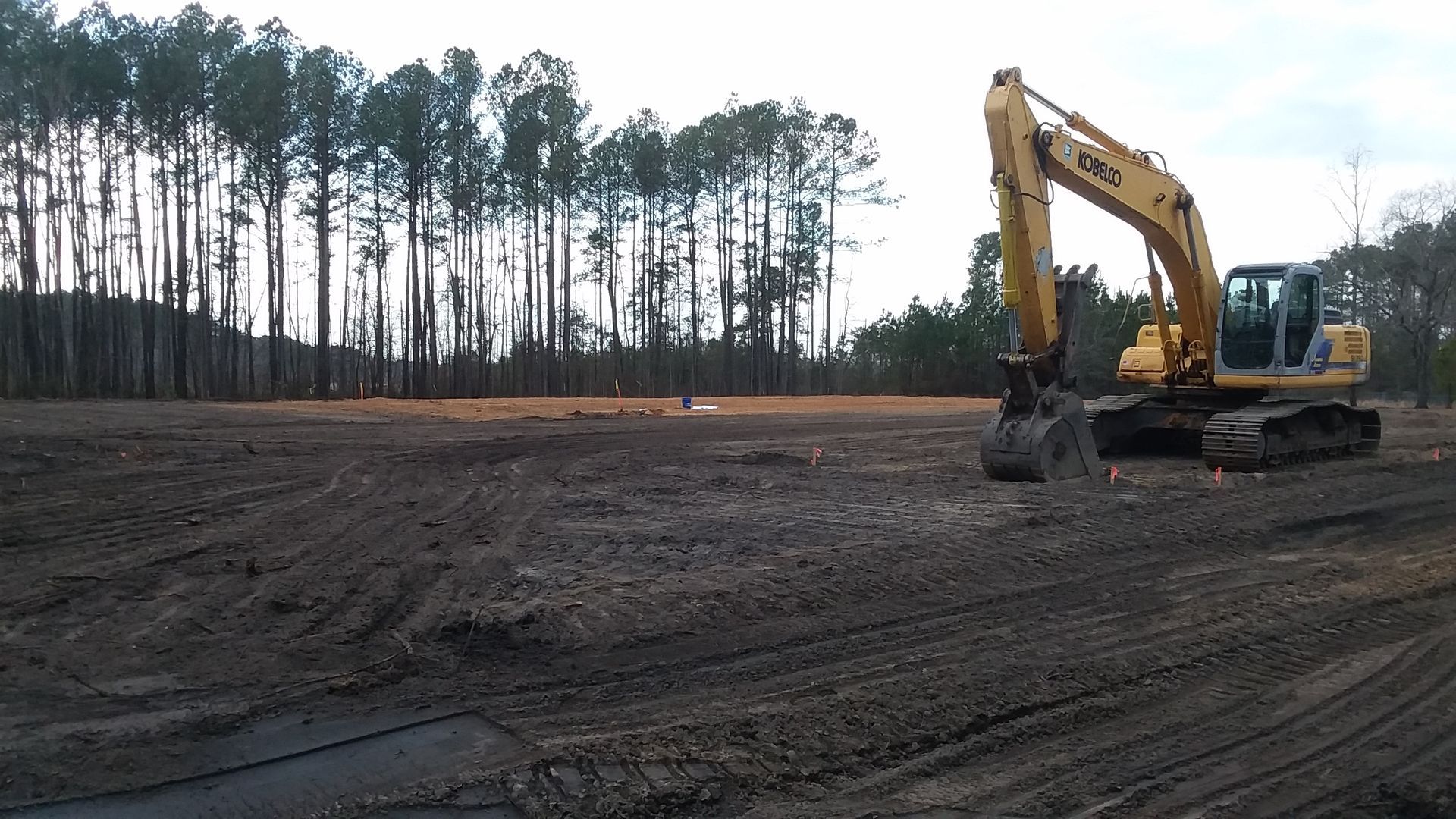 Excavator Working At A Dirt Construction Site