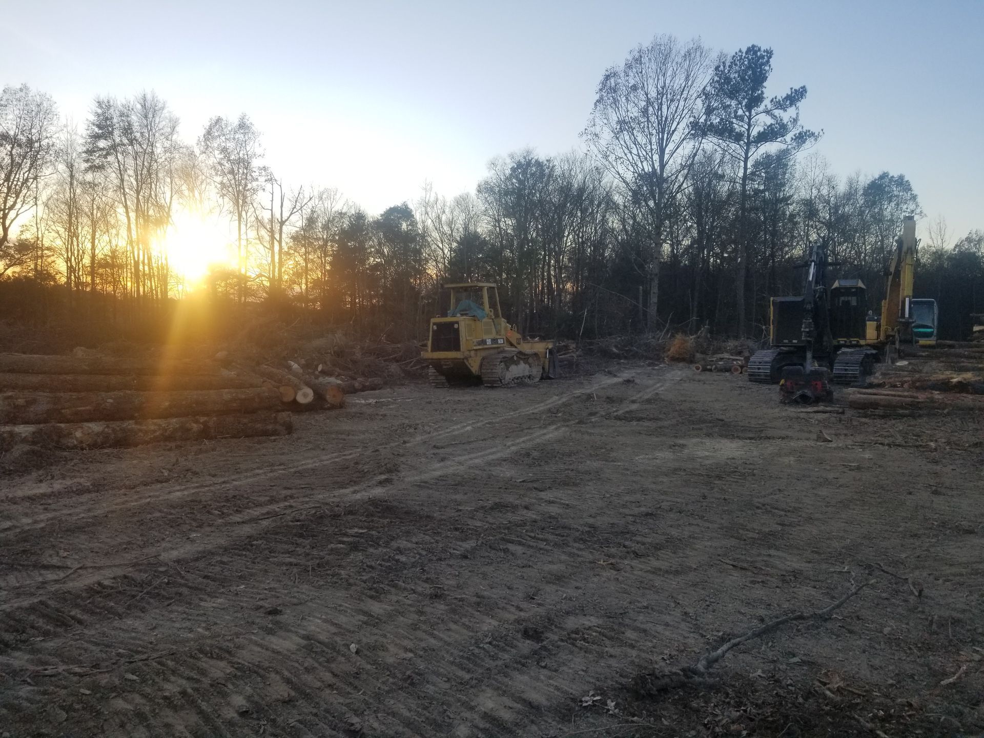 Large dirt mound on a clear-cut construction site.