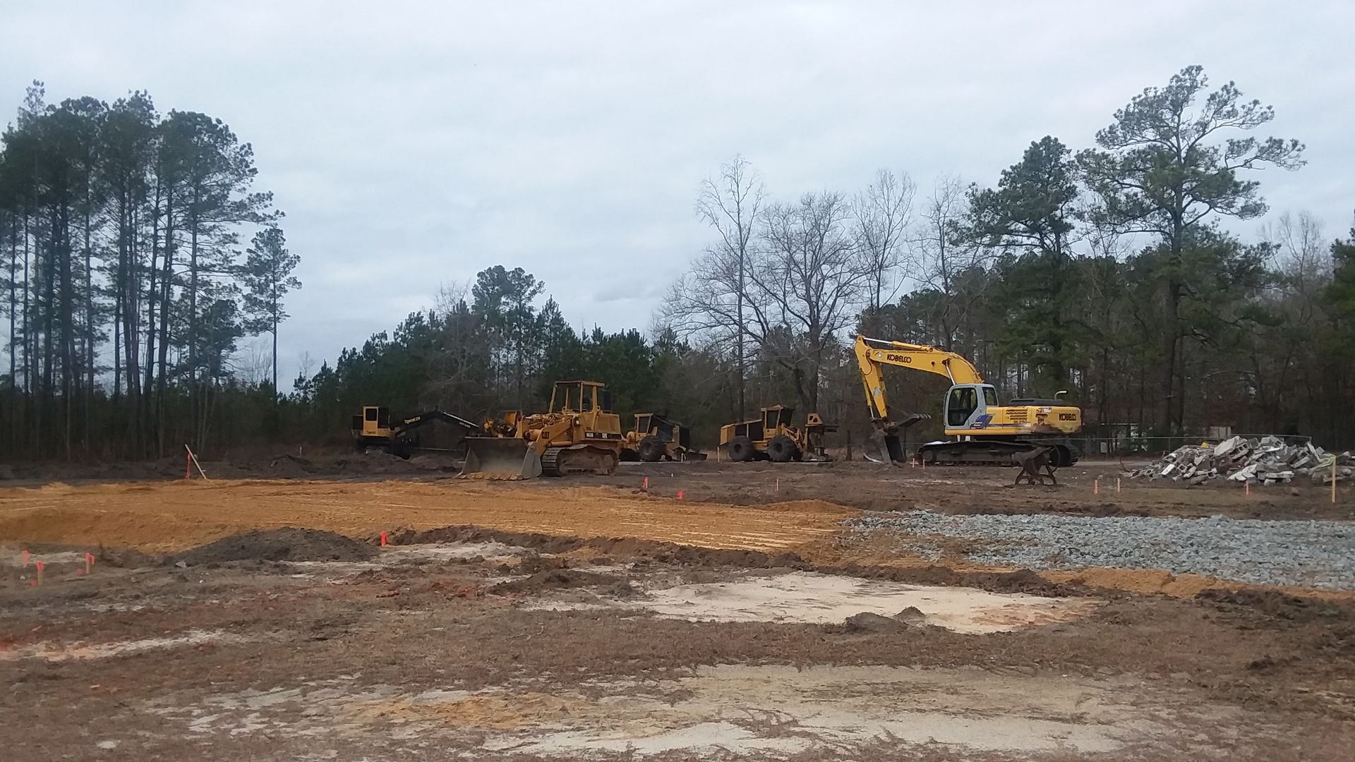 Heavy Construction Machinery On Dirt Lot