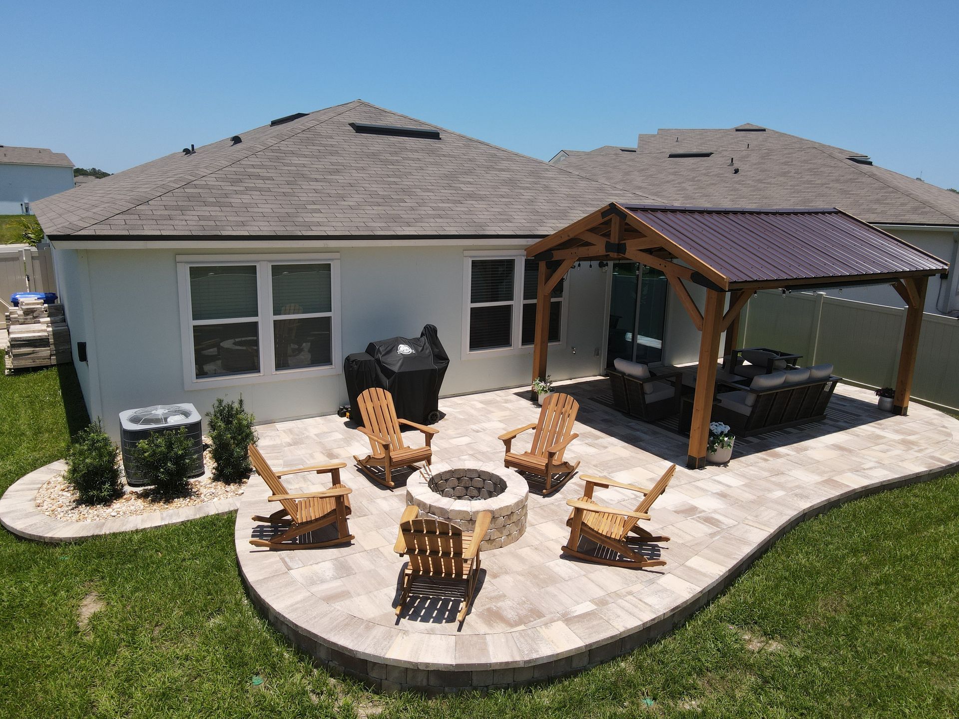 Outdoor Transformations installed a tremron paver fire pit in Ponte Vedra Beach, FL, for a seamless garden path.