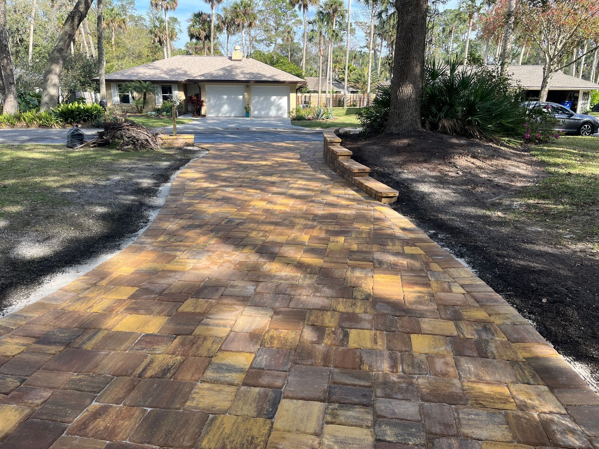 Outdoor Transformations installed Tremron pavers in St. Augustine, FL, for a strong and stylish driveway.