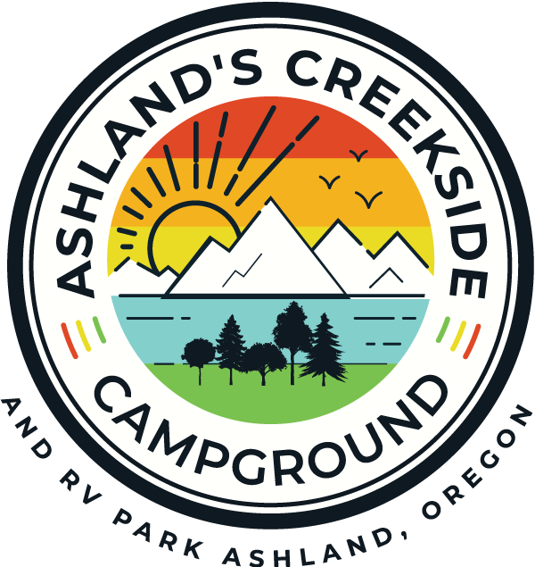 Ashland&rsquo;s Creekside Campground logo with sun, mountains, river, trees, and RV park text, Ashland, Oregon