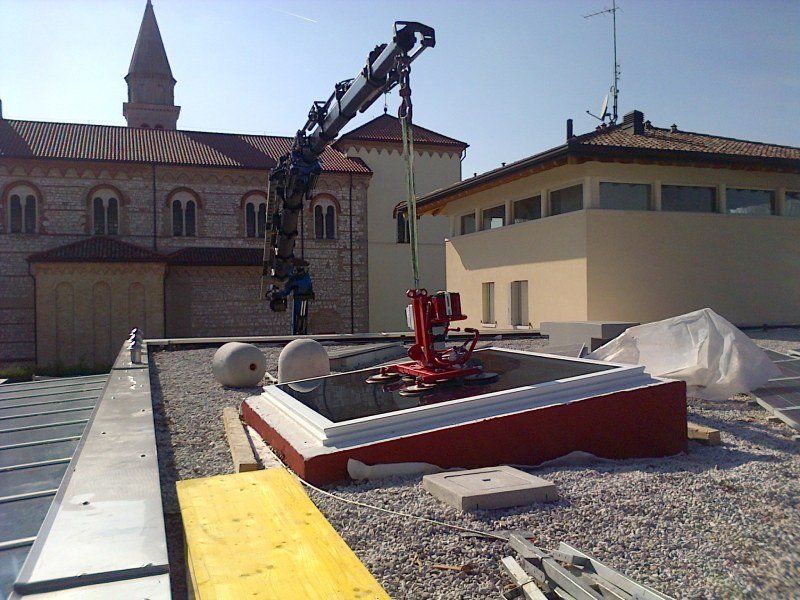 autogrù Fassi F1100 AXP per spostamento merci