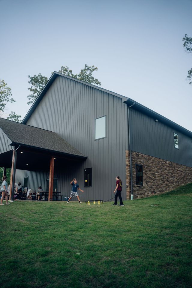 The Chapel at dusk with campers on the lawn
