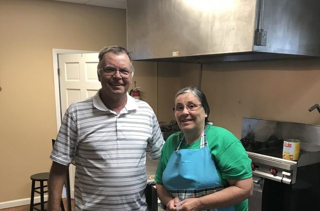 Two cooks smiling in the camp kitchen