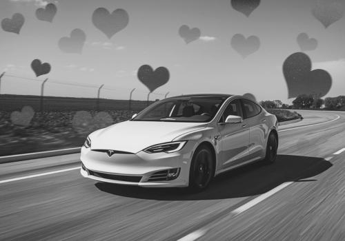 White Tesla sedan driving on a highway with hearts around it in a black-and-white scene.