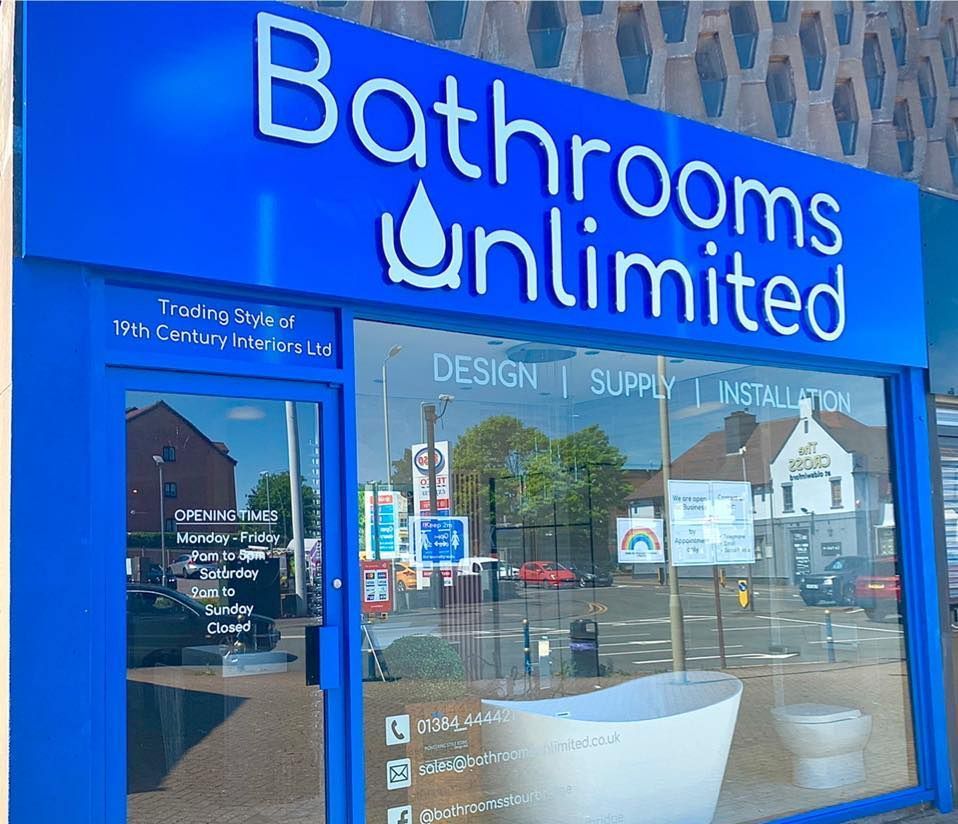 A bathrooms unlimited store front with a blue sign