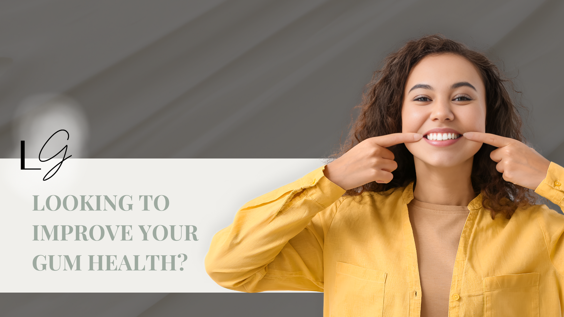A woman in a yellow shirt is pointing at her teeth.