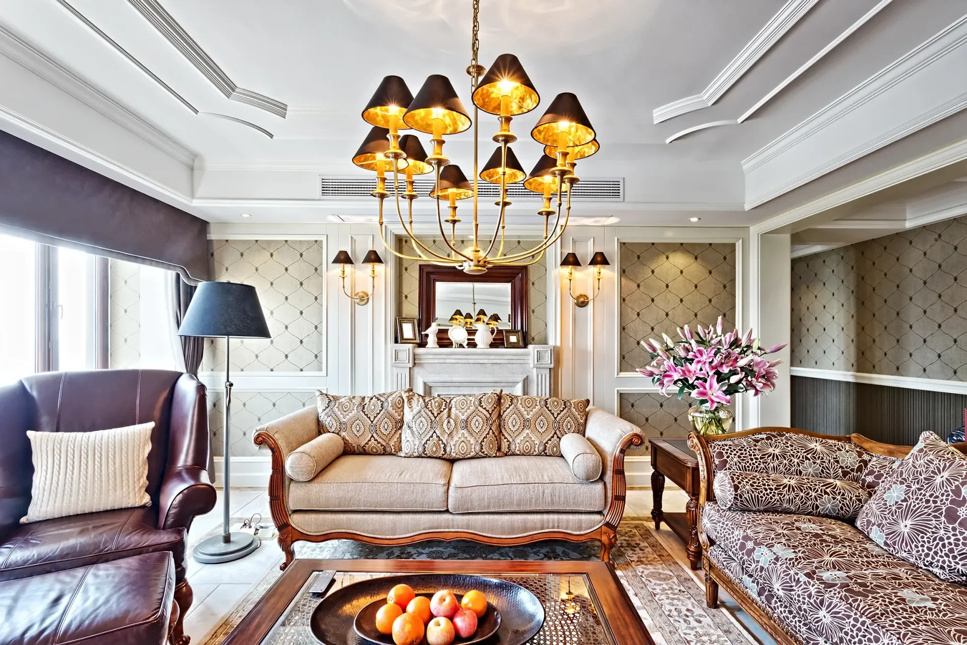 A living room filled with furniture and a chandelier.