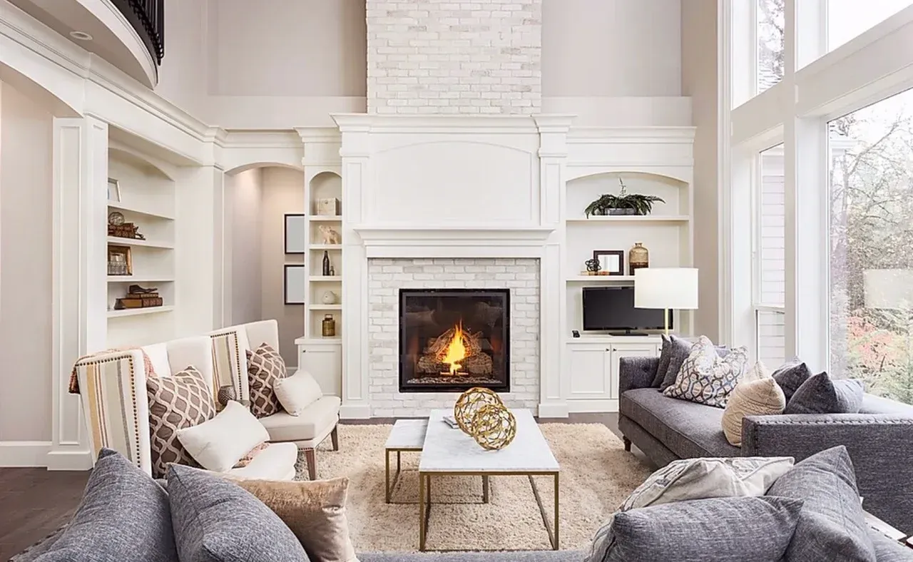 A living room filled with furniture and a fireplace.