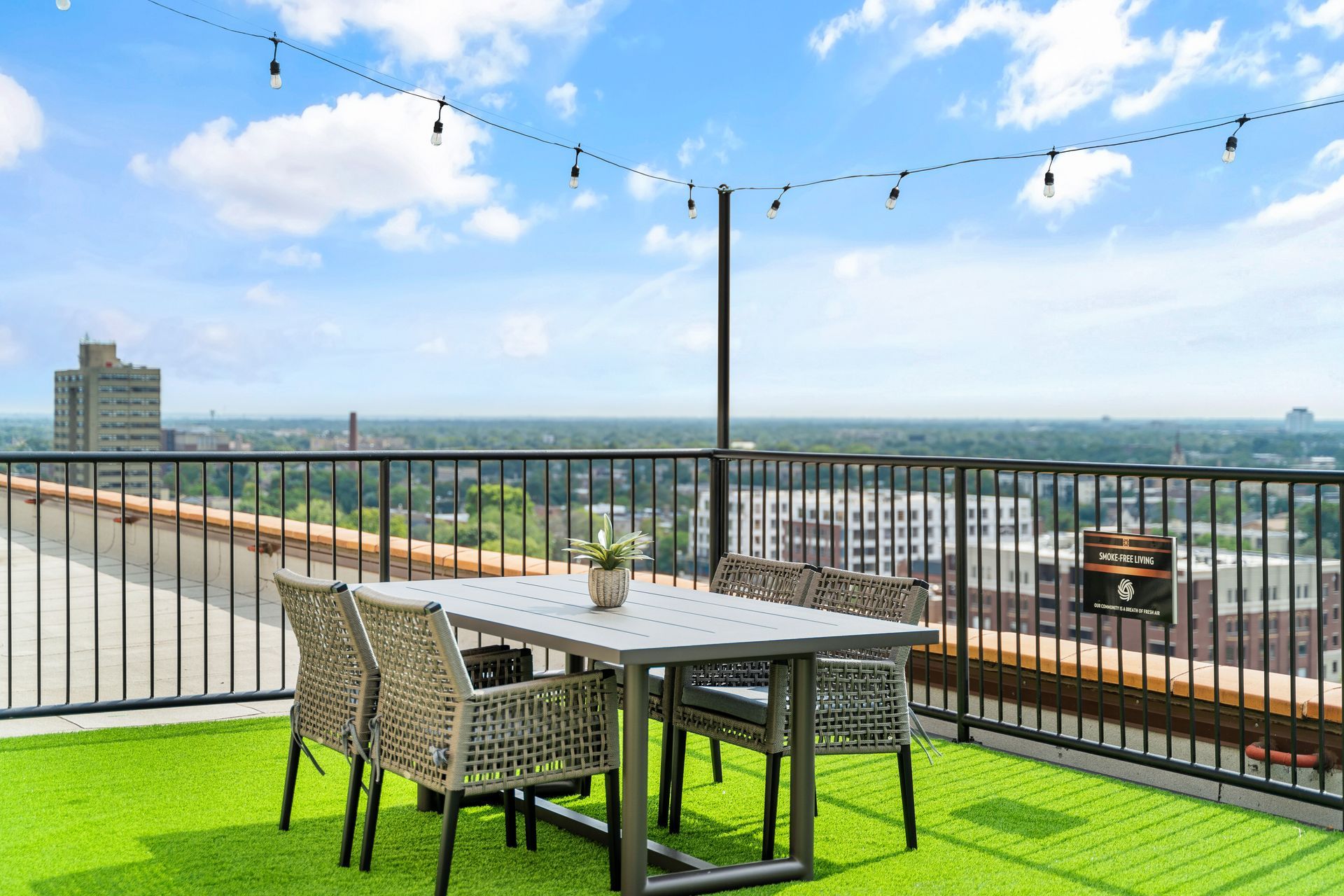 dining table on turf on the rooftop of the 100 Forest Place apartment building in Oak Park, IL