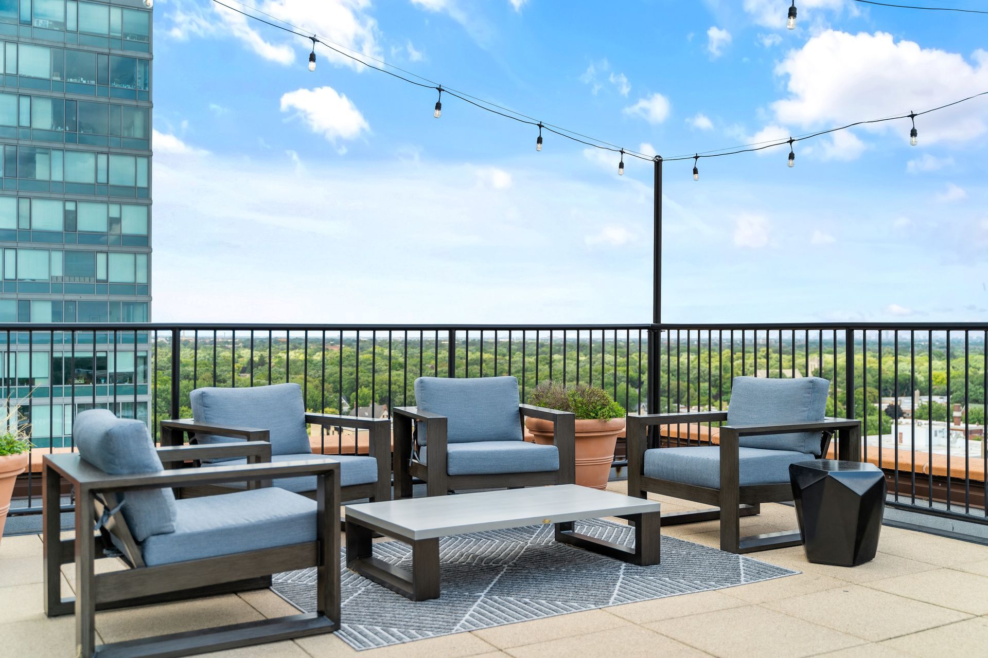 outdoor lounge area on the rooftop of 100 Forest Place apartments in Oak Park