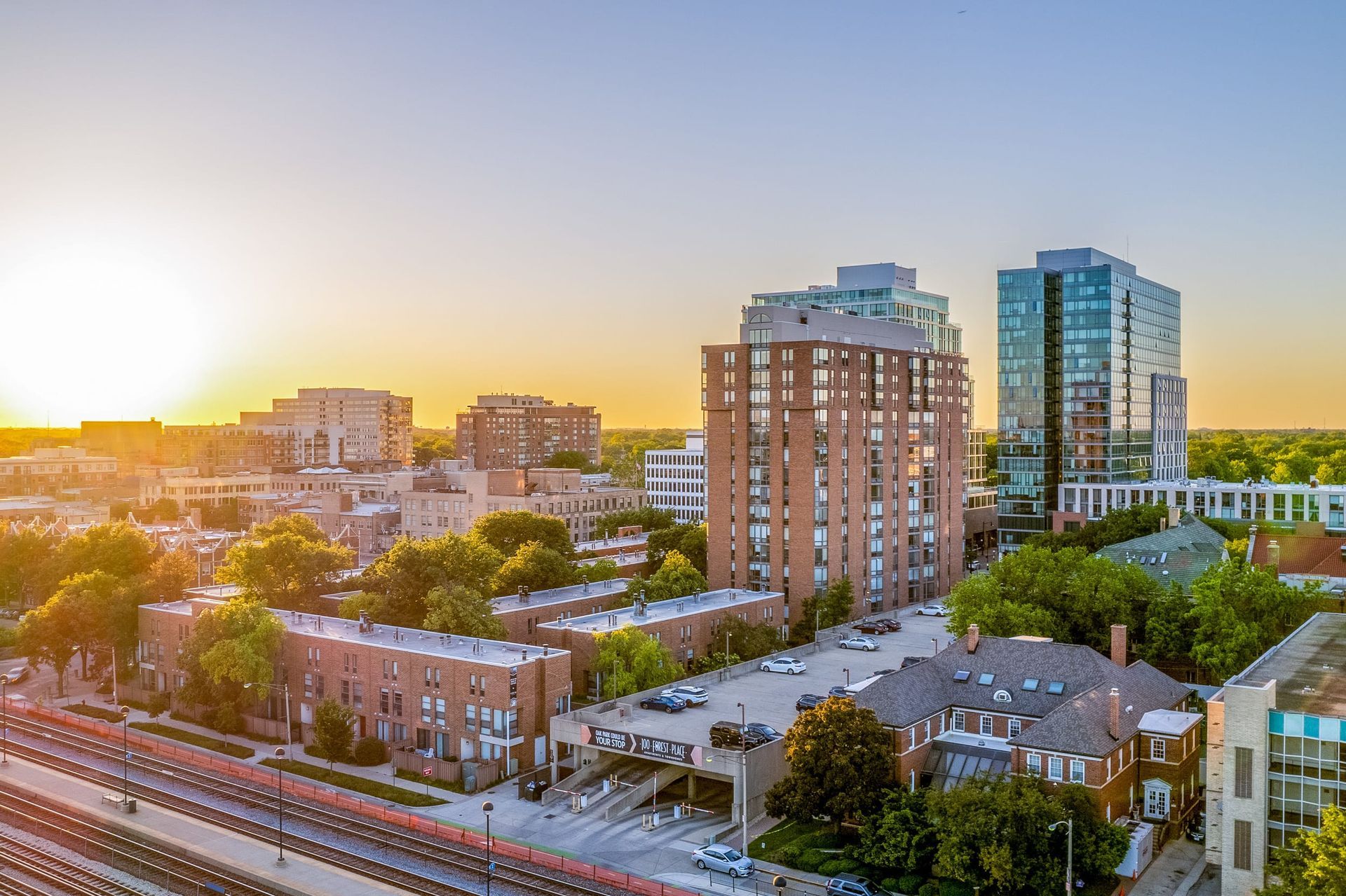 view of Oak Park, IL, and the 100 Forest Place apartment building at dusk