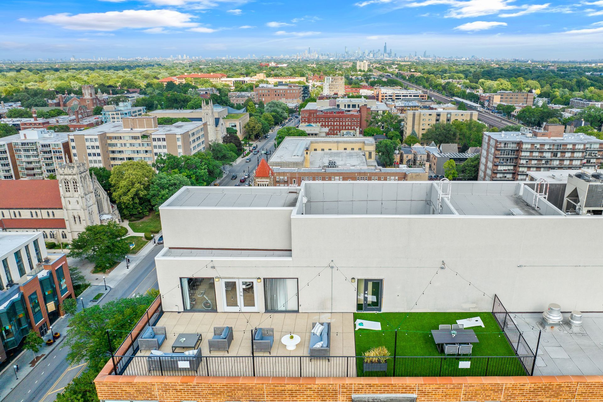aerial view of 100 Forest Place's rooftop lounge and downtown Oak Park, IL