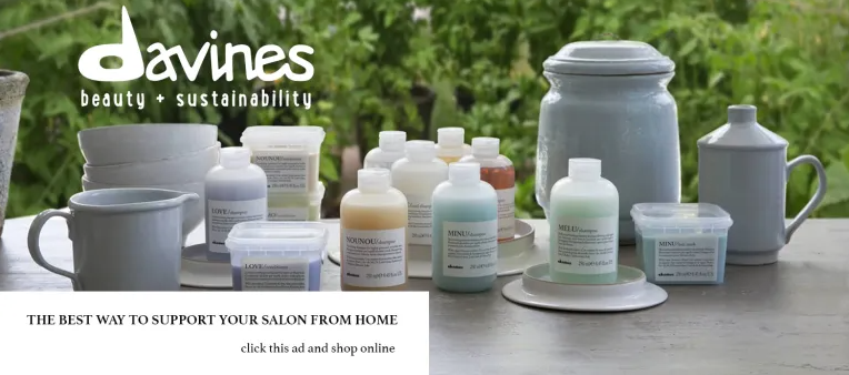 A bottle of davines beauty and sustainability is on a table