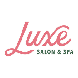 The logo for luxe salon and spa is pink and green.