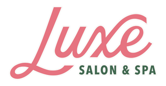 The logo for luxe salon and spa is pink and green.