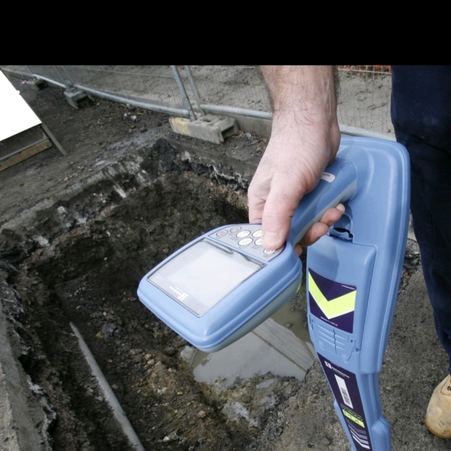 A Person is Holding a Device That Says ' Rcr ' — Dowds Pipe and Cable Locating in Bondi, NSW