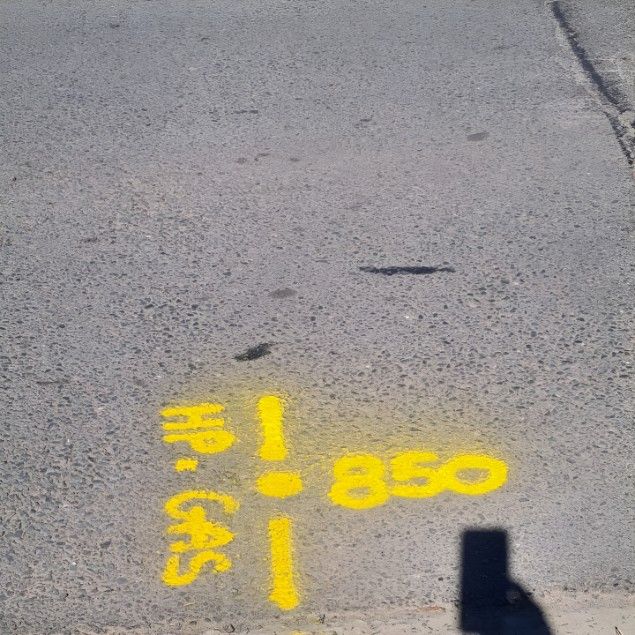 A Yellow Marking on a Road That Says 850 — Dowds Pipe and Cable Locating in Shellharbour, NSW
