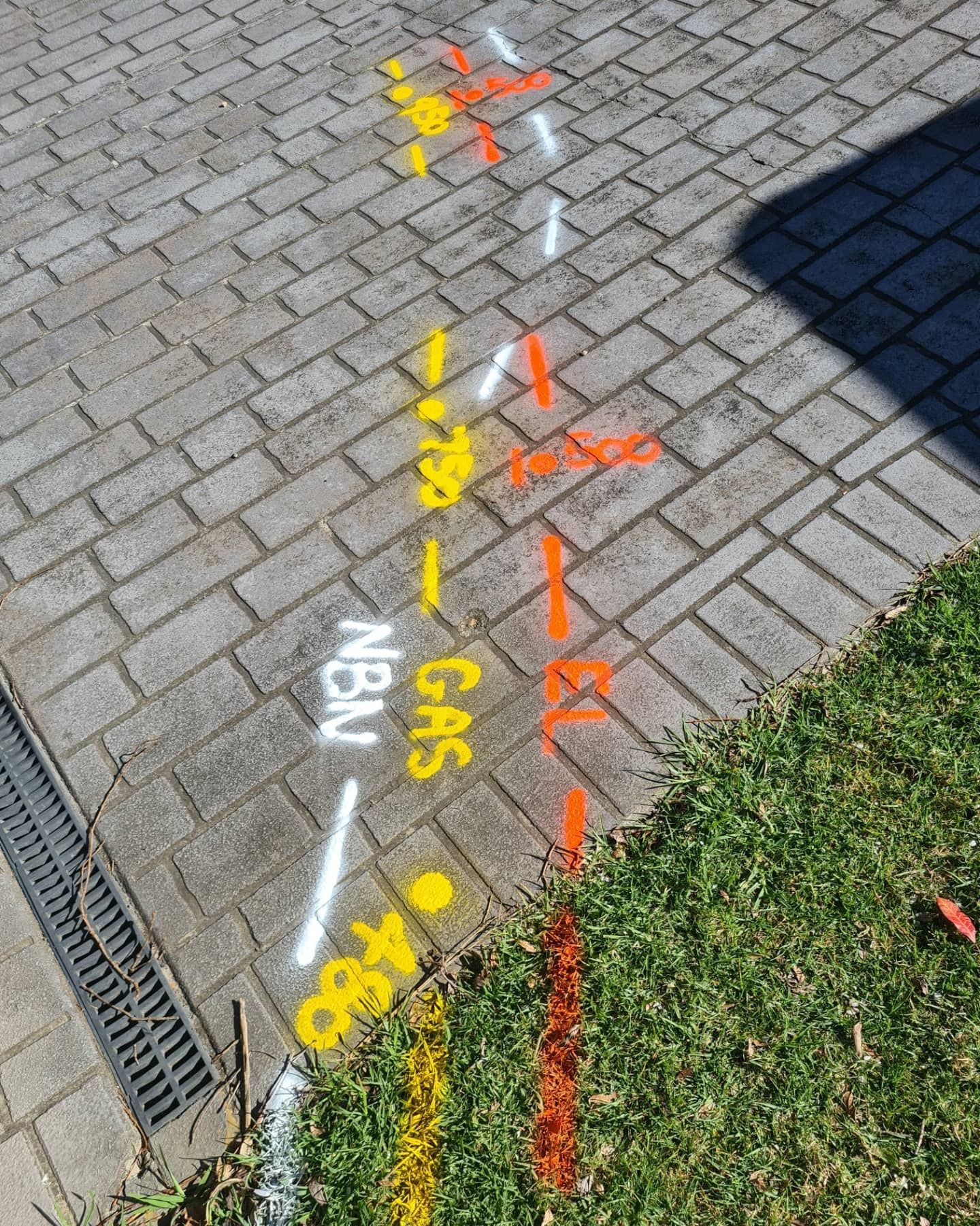 A Brick Sidewalk With a Line Painted on It That Says Gas — Dowds Pipe and Cable Locating in Penrith, NSW