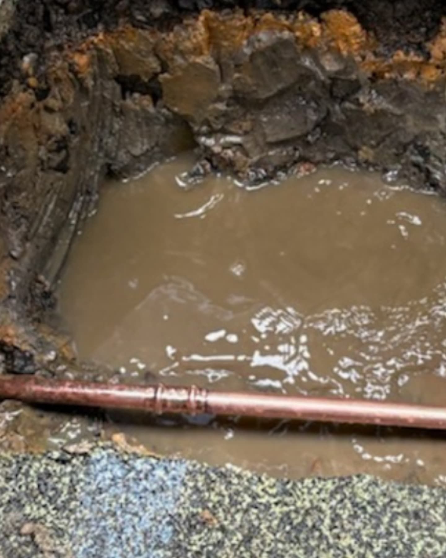 underground pipe with water around it — Dowds Pipe and Cable Locating in Farmborough Heights, NSW