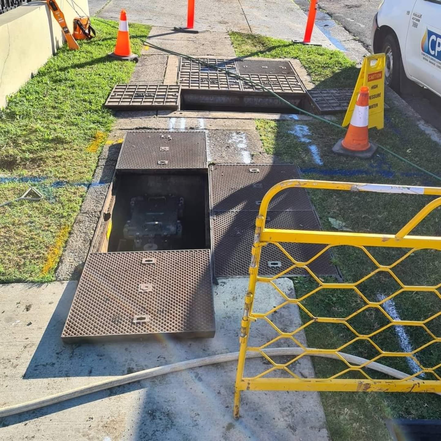 A Manhole Cover is Open on the Side of the Road — Dowds Pipe and Cable Locating in Penrith, NSW