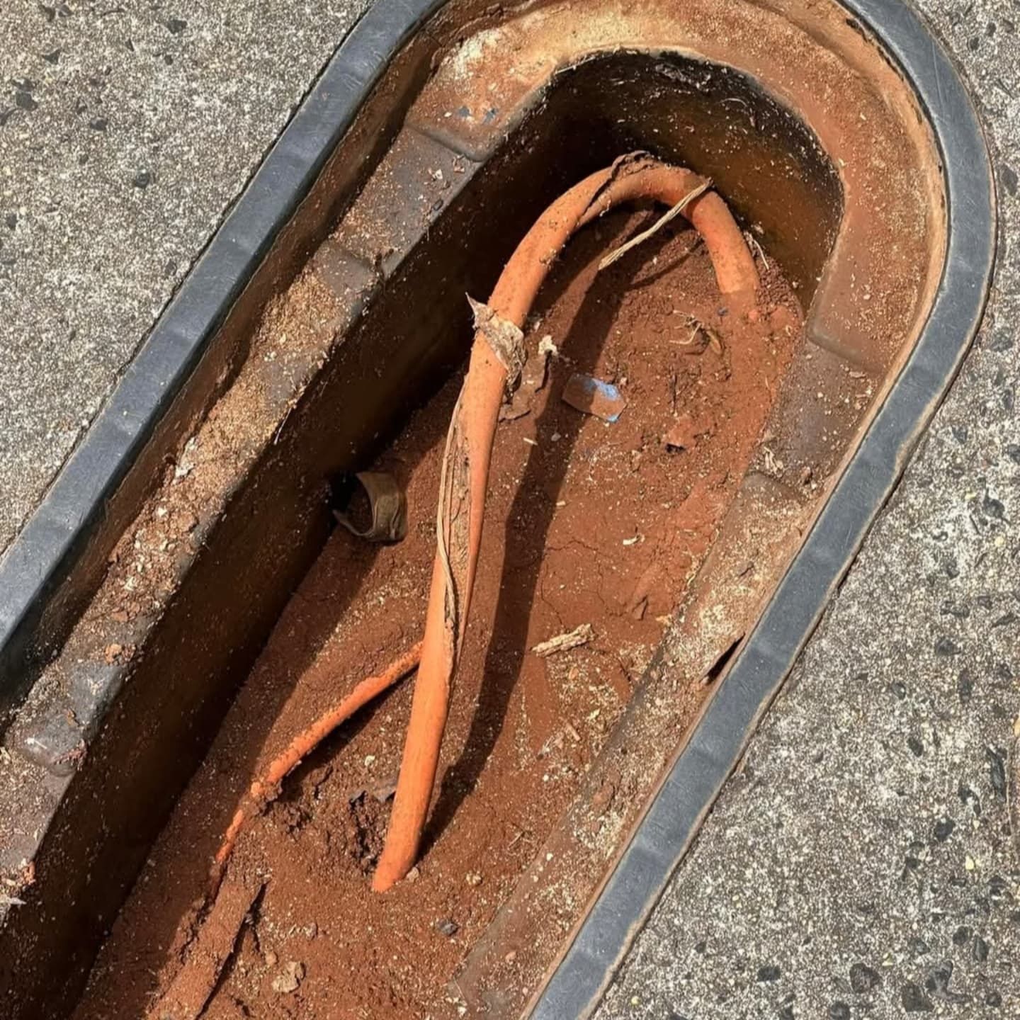 a blocked storm pipe coming out of the ground — Dowds Pipe and Cable Locating in Farmborough Heights, NSW