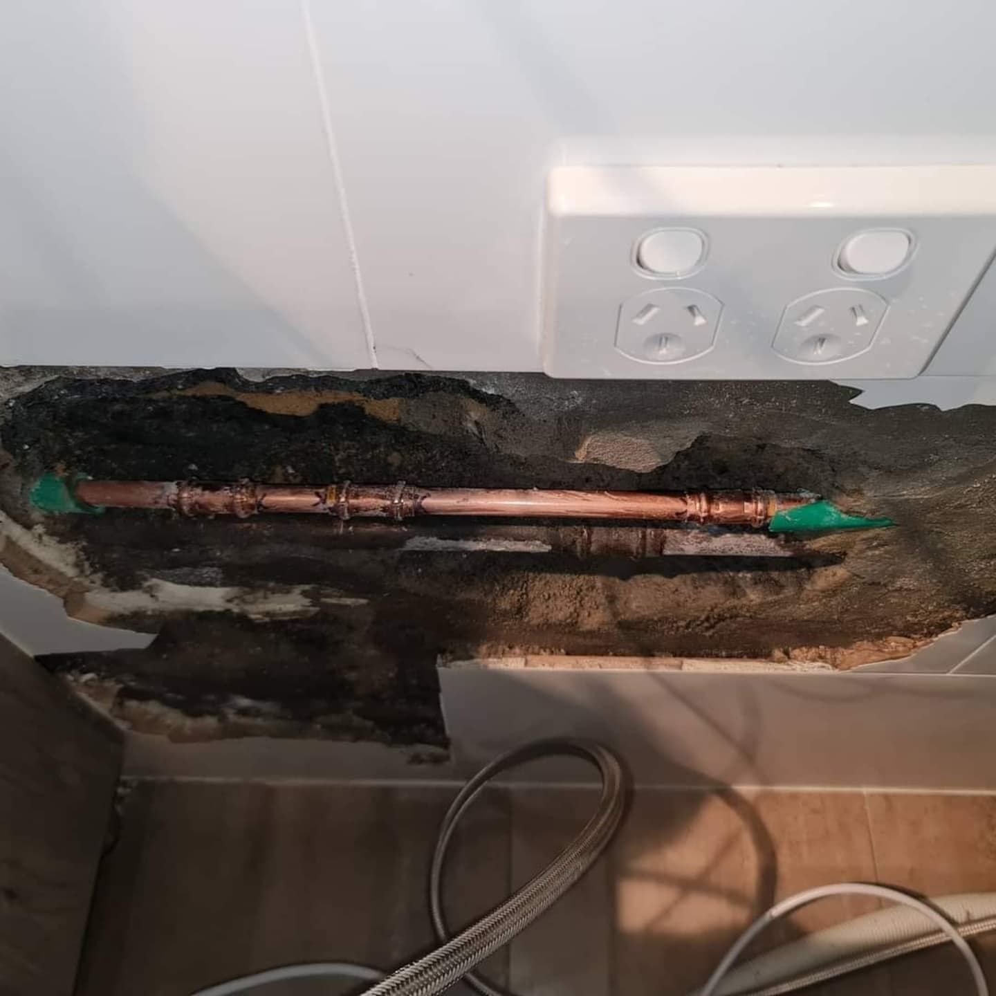 A wall has been cut open to reveal cables — Dowds Pipe and Cable Locating in Farmborough Heights, NSW