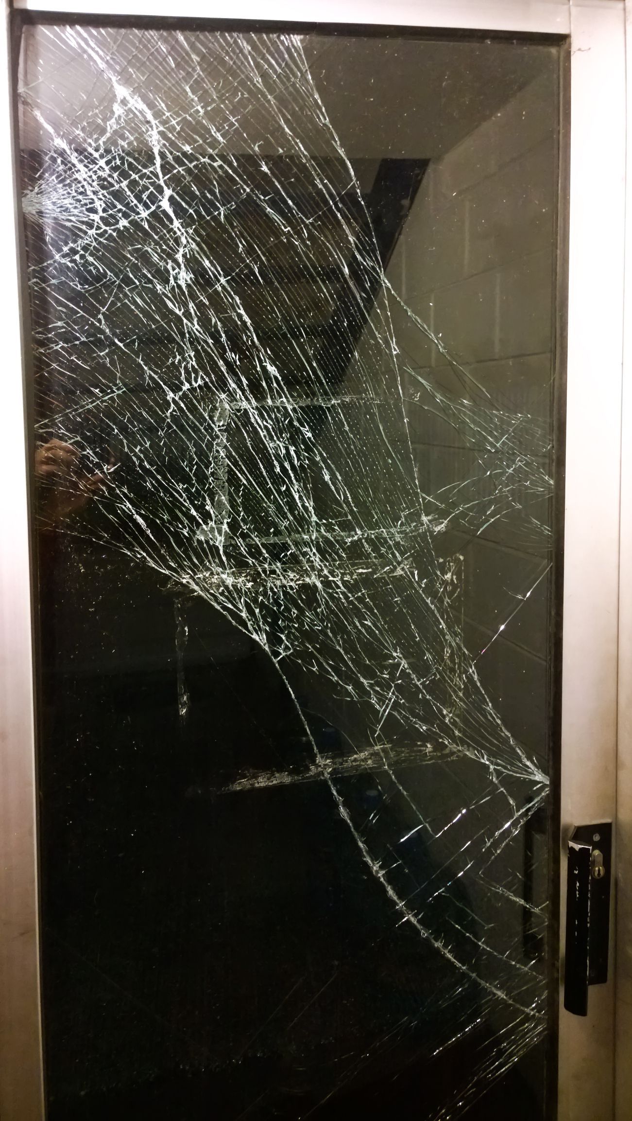 The glass door panel was smashed, requiring urgent professional repair. The glass door panel was smashed, requiring urgent professional repair.