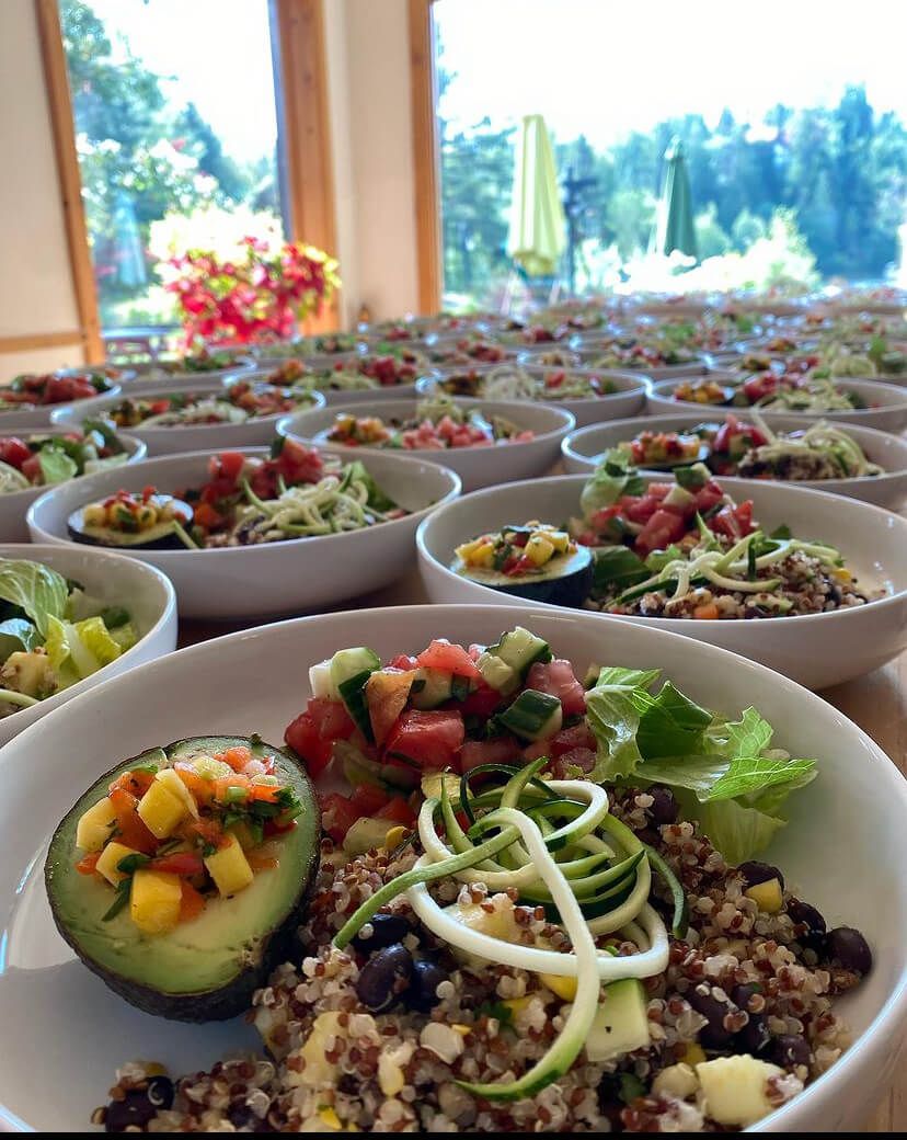 A bunch of bowls of food are sitting on a table.