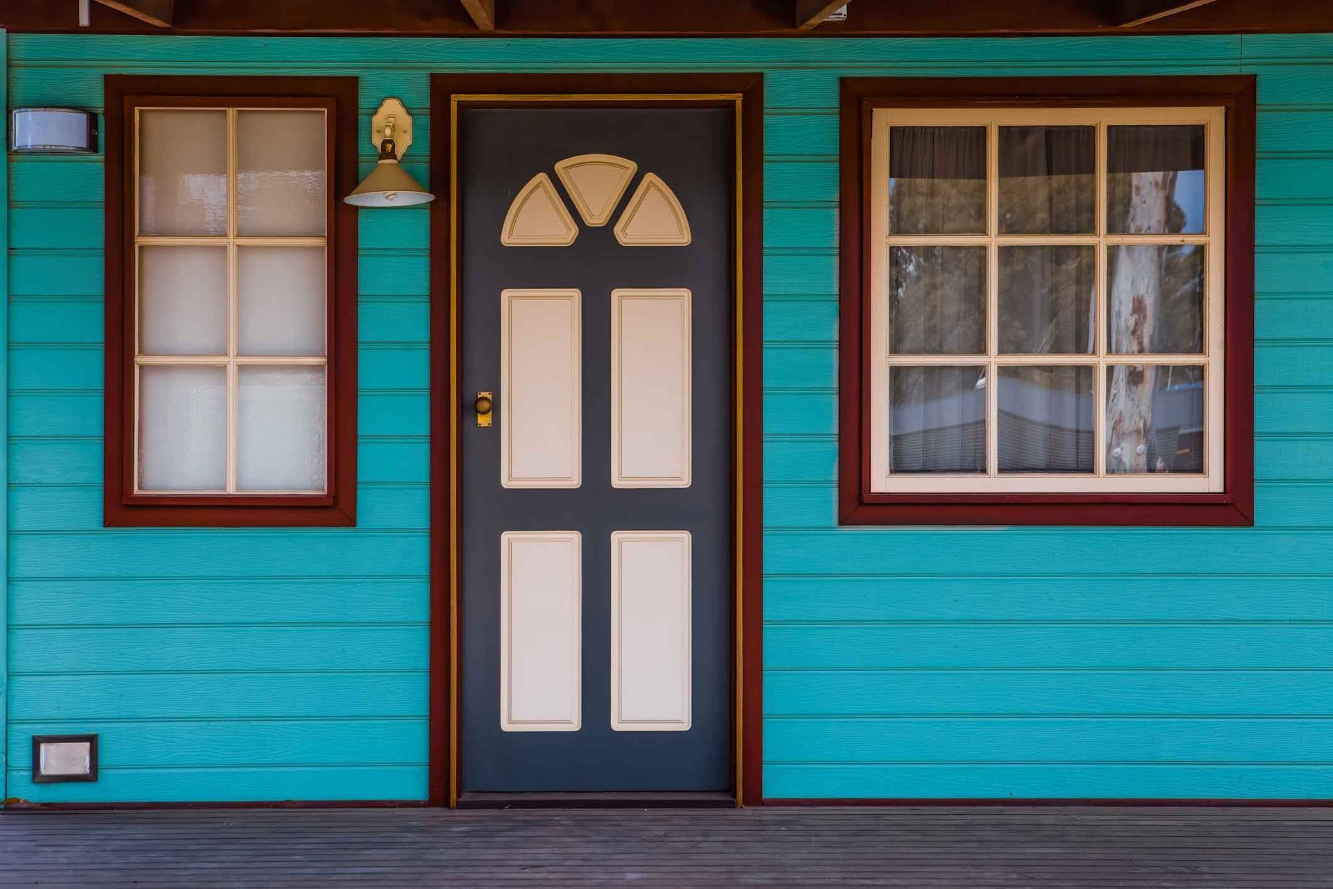 A Blue House With A Black Door And Two Windows – Bannockburn, VIC - Kevin Connors Painters & Decorators