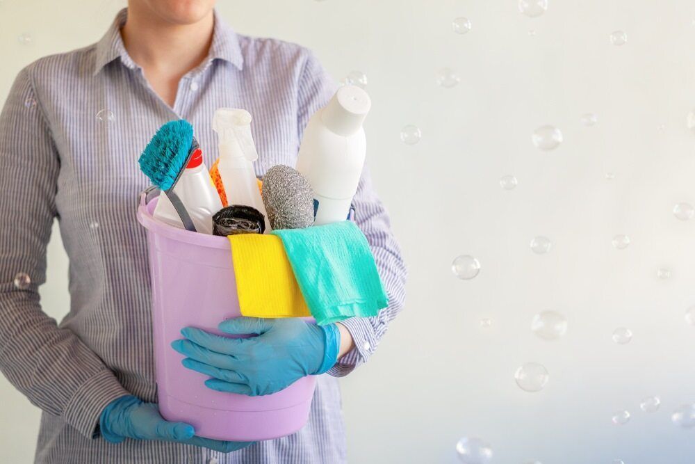 Woman Carry A Bucket Of Tools For Cleaning — Toowoomba Cleaning Co in South Toowoomba, QLD