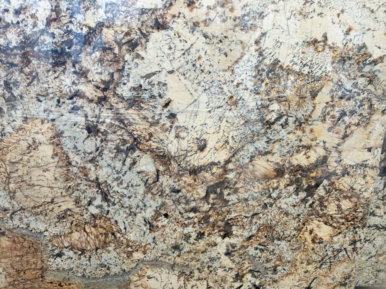A close up of a granite counter top with a marble texture