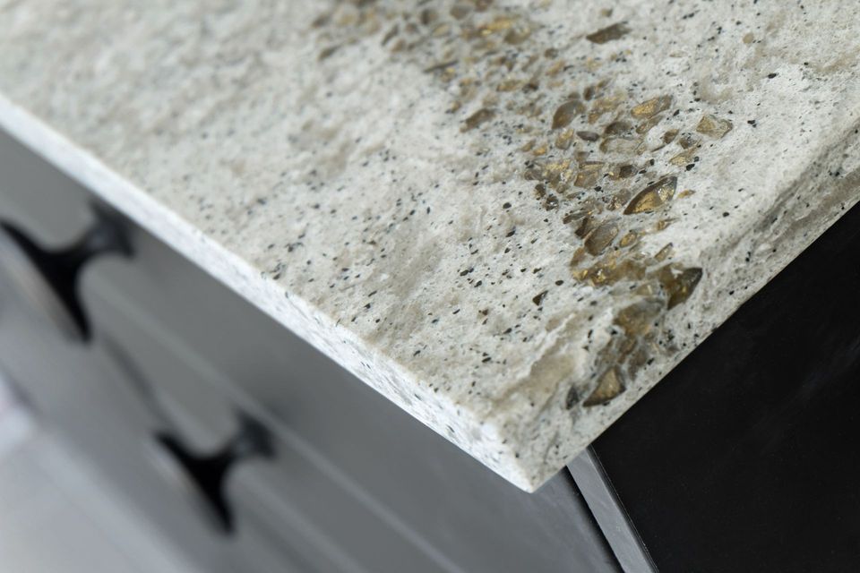Beautiful Quartz Stone Counter top in kitchen room with black wooden cabinet