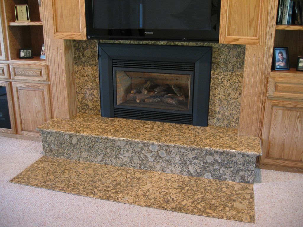A fireplace with a flat screen tv above it