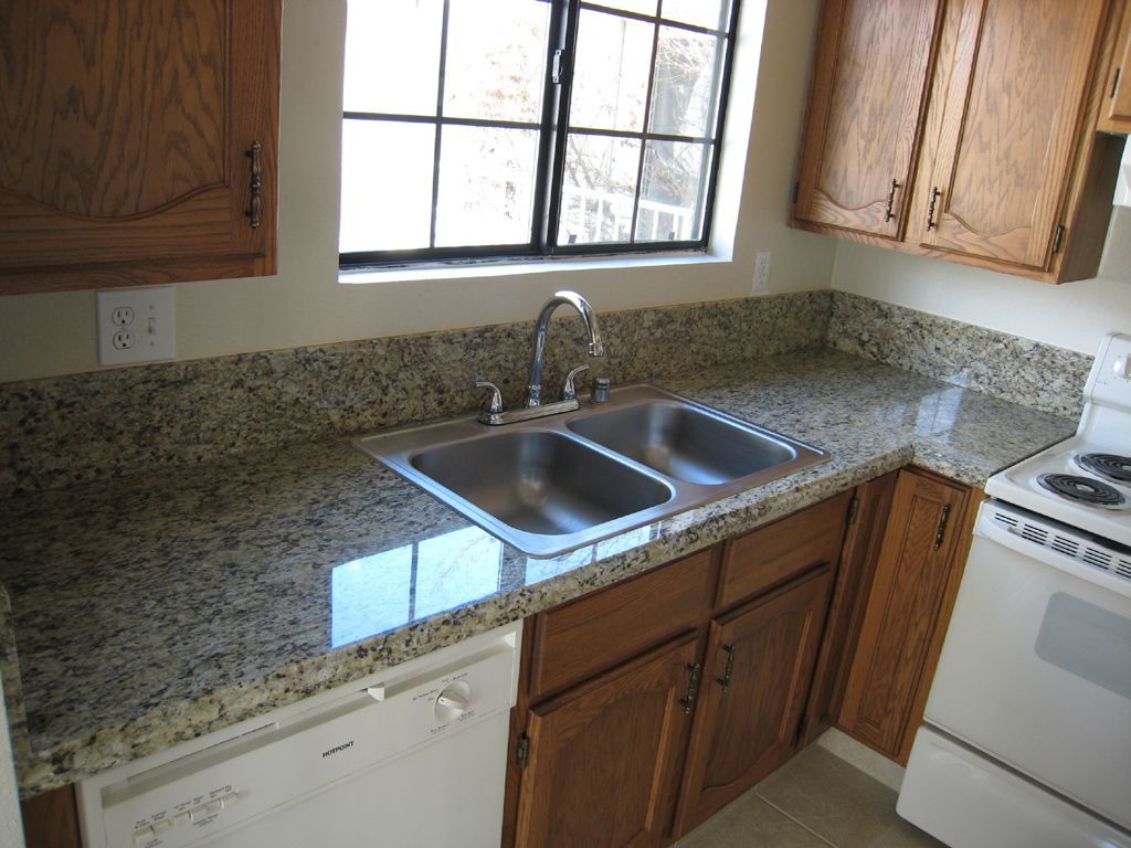 A kitchen with granite counter tops and a sink