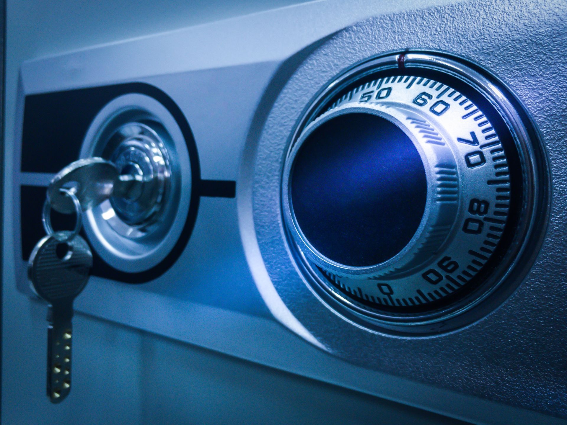 A Close up Of a Safe with A Key in It A close up of a safe with a key in it