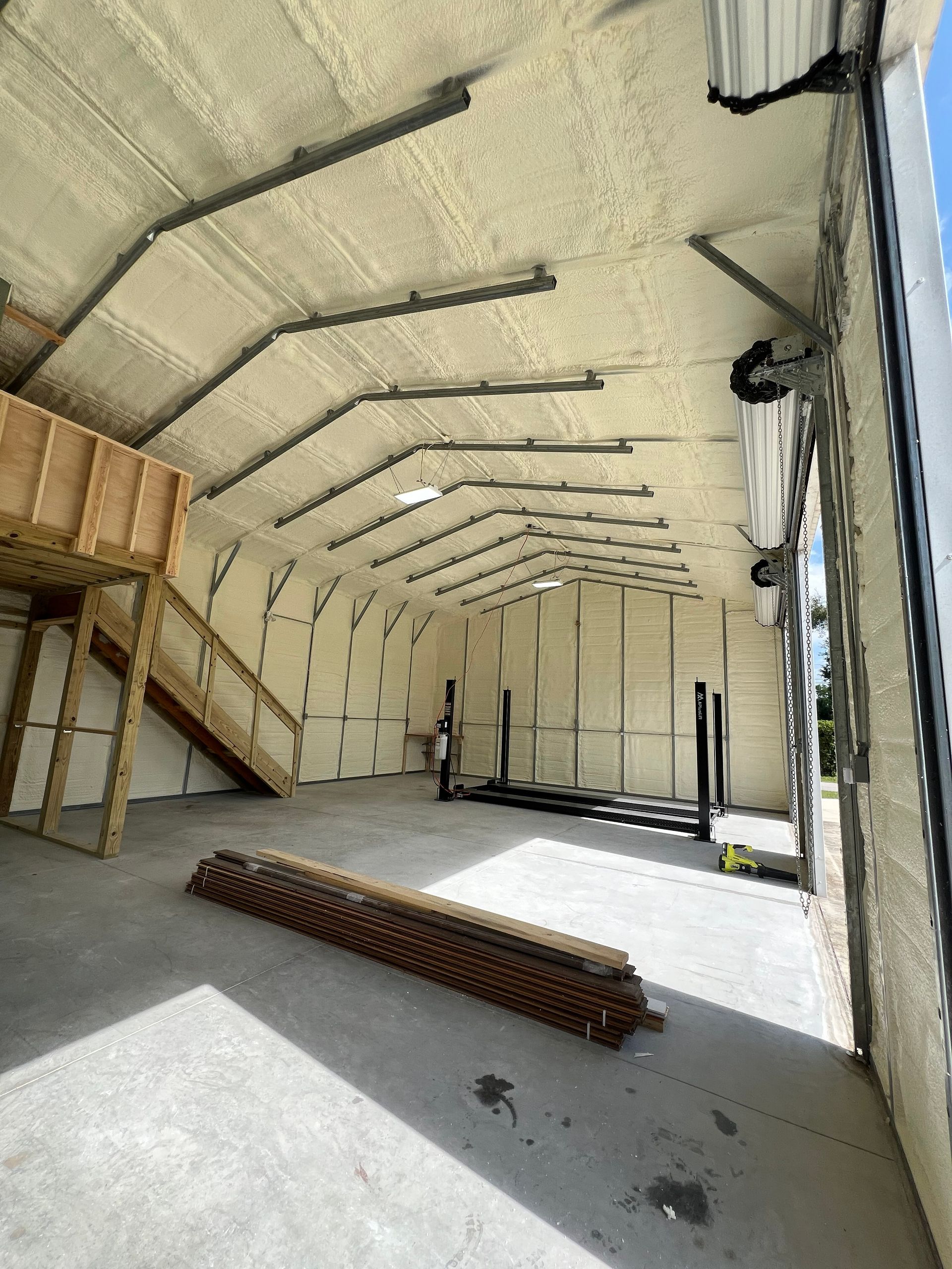 A large warehouse with a lot of insulation on the walls and ceiling.